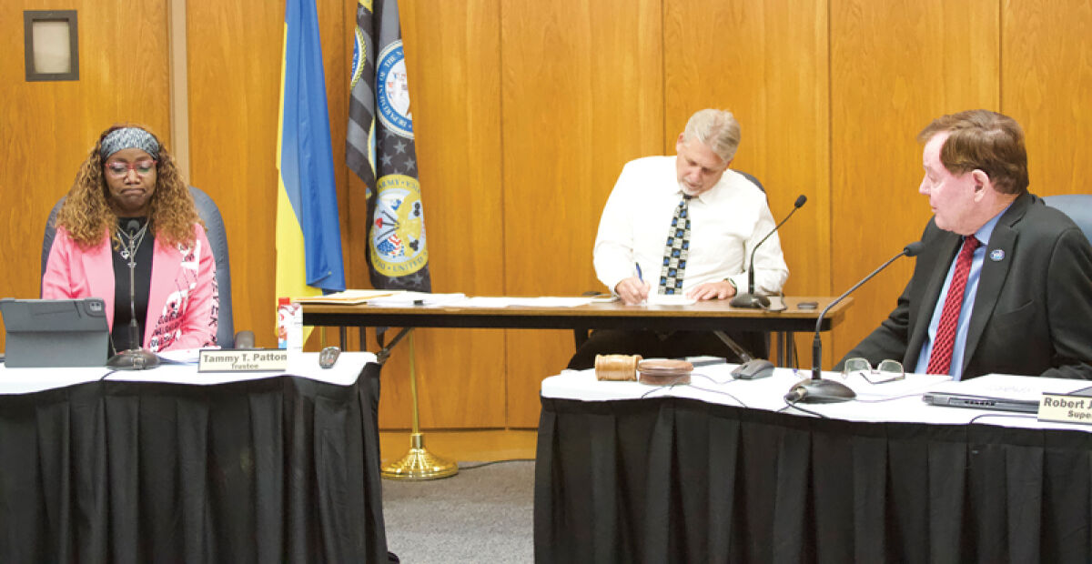  Trustee Tammy Patton tells outgoing Supervisor Bob Cannon that he was a mentor to her at the Nov. 12 Clinton Township Board of Trustees meeting. 