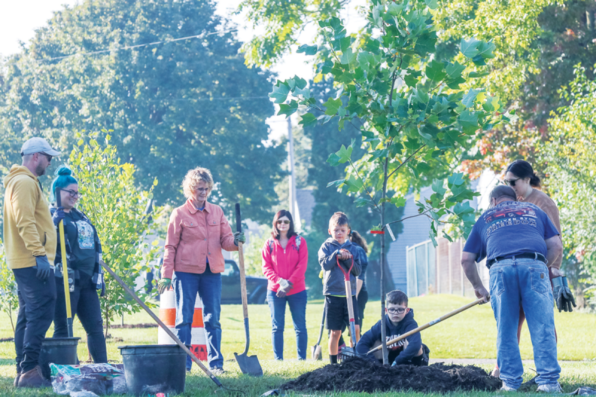  Volunteers and city staff gathered at Karam Park in September 2023 for a tree-planting event. Officials say that a federal grant will allow the city to hire a certified arborist documenting the state of trees throughout the city. 