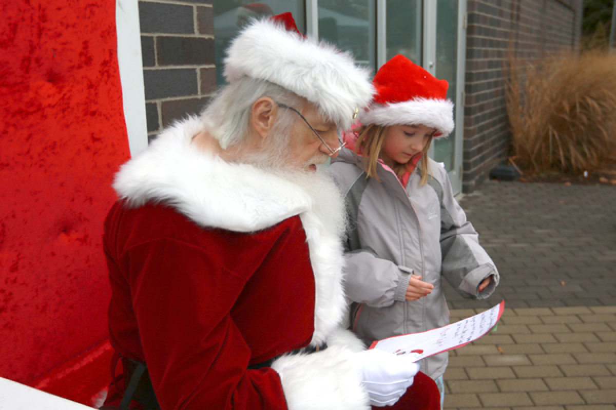  Sophie Vanvleet meets with Santa Claus during his tour of Ferndale parks last year. Santa will return to the city this year at Schiffer Park Dec. 7. 