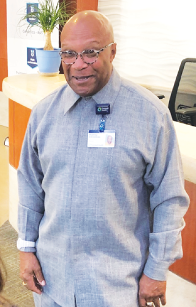  Corewell Health Beaumont Grosse Pointe Hospital security officer Stanley Christmas greets a hospital visitor. 