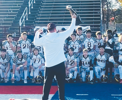  The Rochester Raiders varsity football team celebrates a 46-22 win over the Plymouth Canton Steelers in the MYFCC Super Bowl Nov. 2 at Westland John Glenn High School. 