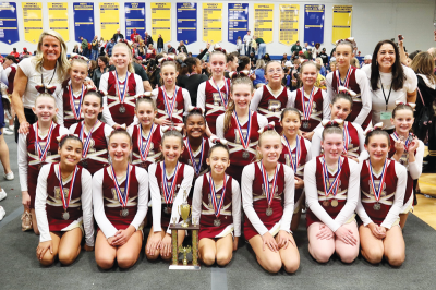  The Rochester Raiders junior varsity team celebrates a runner-up finish at MYFCC’s Super Cheer Oct. 26 at Madonna University. 