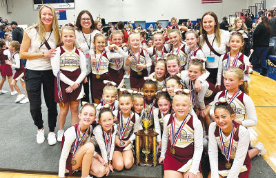  The Rochester Raiders freshman team celebrates a first-place finish at MYFCC’s Super Cheer Oct. 26 at Madonna University. 