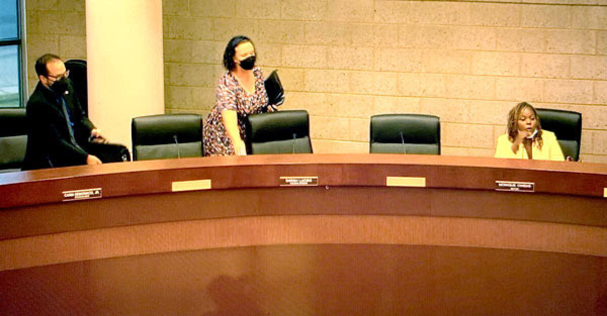  In an image taken from the meeting's recording on YouTube, Eastpointe City Council members Cardi DeMonaco Jr., left, and Sarah Lucido, center, stand and leave the council’s Sept. 6 meeting as Mayor Monique Owens continues arguing with a resident during the meeting’s hearing of the public. 