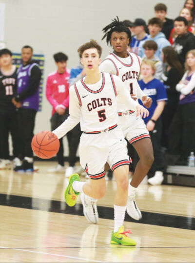  Troy senior Mason Parker runs the floor during a game last season. 