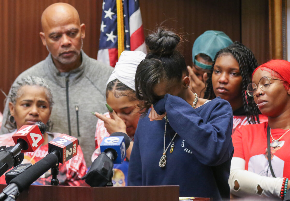  Lynnira Hayden is overcome by emotion as she talks about the loss of her father Cedric Hayden Jr. as she is surrounded by her grandparents, aunt and other family members. 