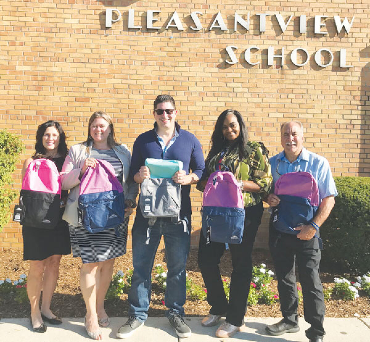  On Aug. 31, Pleasantview Elementary School in Eastpointe received 50 backpacks through AT&T’s Tools for Learning campaign. Pictured from left are Lori Doughty, AT&T Michigan external/regulatory affairs director; Eastpointe Community Schools Superintendent Christina Gibson; state Sen. Michael McDonald; Pleasantview Principal Falicia Moreland-Trice; and McDonald’s district director, Phil Rode. 