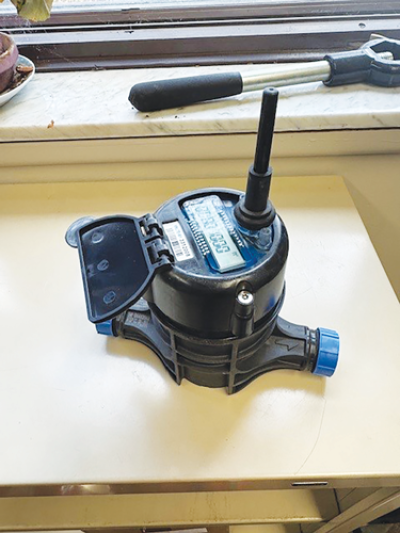  One of the new Metron water meters placed on a desk. The meters use cellular data to be remotely read and track water usage in real time. 