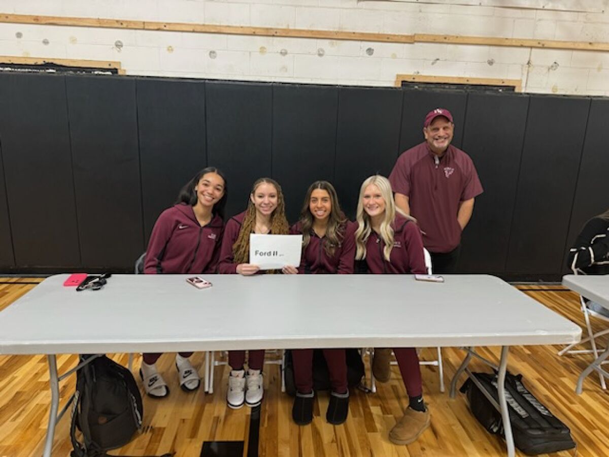  Utica Ford II is ready to talk basketball at the Macomb Area Conference Red boys and girls basketball media day Nov. 24 at The Compound Athletics in Sterling Heights. Pictured from left are Anayya Davis, Tyra Wright, Maria Raciti, Emily Leusby and head coach Matthew Joseph. 