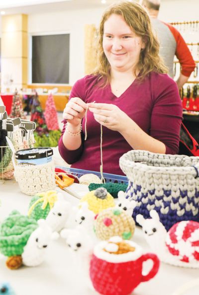  Julie Nicholls, from Nicholls Knits LLC, creates plushies during the art show. The plushies were a small portion of the handmade knit and crochet items she offered. 