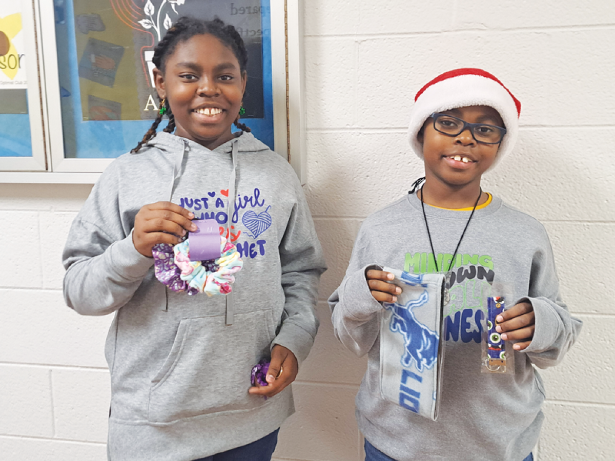  Siblings Lillian Evans, 12, and William Evans IV, 10, show off some of the items they sell at the school craft shows.  