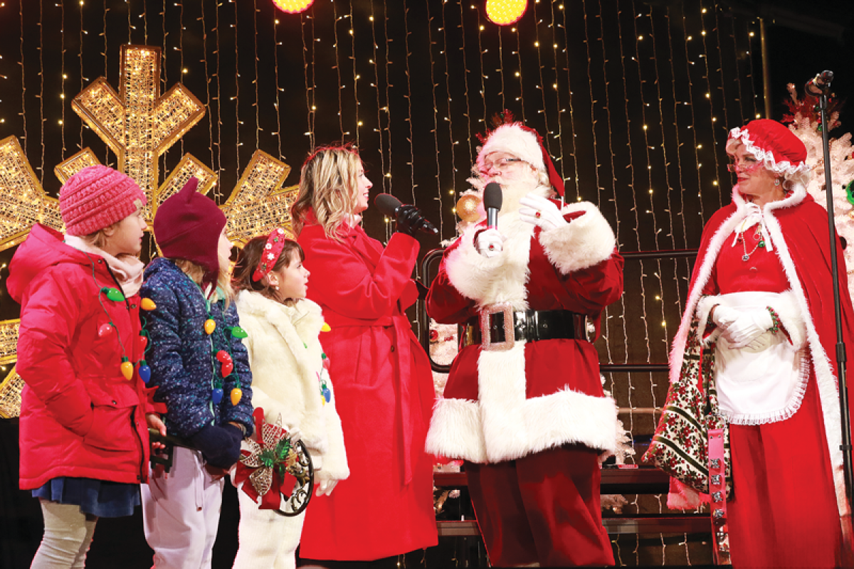  Children present Santa Claus with the key to the township at Shelby Township’s Christmas Aglow on the Civic Center campus Dec. 6. 