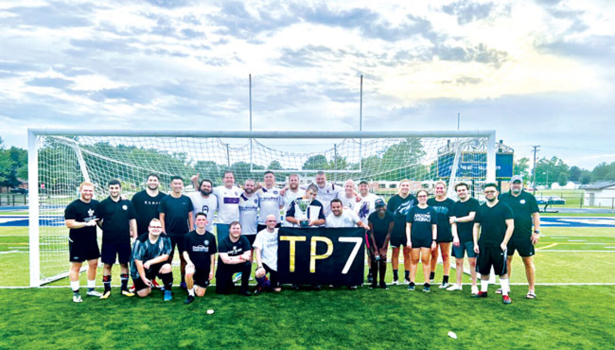  The Staff vs. Supporters Tim Pontzer Memorial Cup ended with both teams holding up the “TP7” banner in honor of Tim Pontzer. 