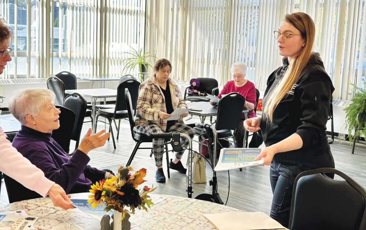  Clawson police officer Aundreana Beydoun speaks to seniors at the Clawson Senior Center, 509 Fisher Court, about the C.O.P.S Care program that she created. 