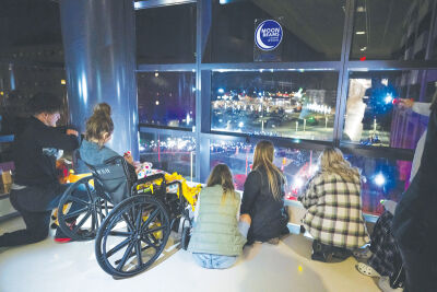  For 10 minutes each night starting at 8 p.m Dec. 9-23, people of all ages can use flashlights to beam up light to the windows of the pediatric unit at Corewell Health William Beaumont University Hospital. Patients inside the hospital return the glow with flashlights of their own. 