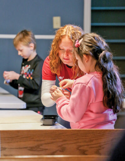  FARM Science Lab educator Kassie Acker helped the students create their own mini farms that can be worn around their neck. The lesson focused on specific things needed on a farm such as soil, sun, seed and animals. 