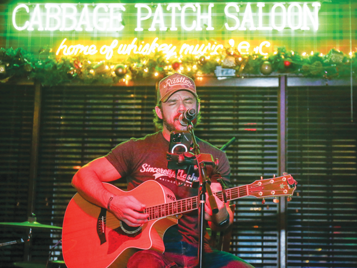  Metro Detroit native Mac Watts performs for the hometown crowd during a show Nov. 25 at the  Cabbage Patch Saloon in Grosse Pointe Park. 