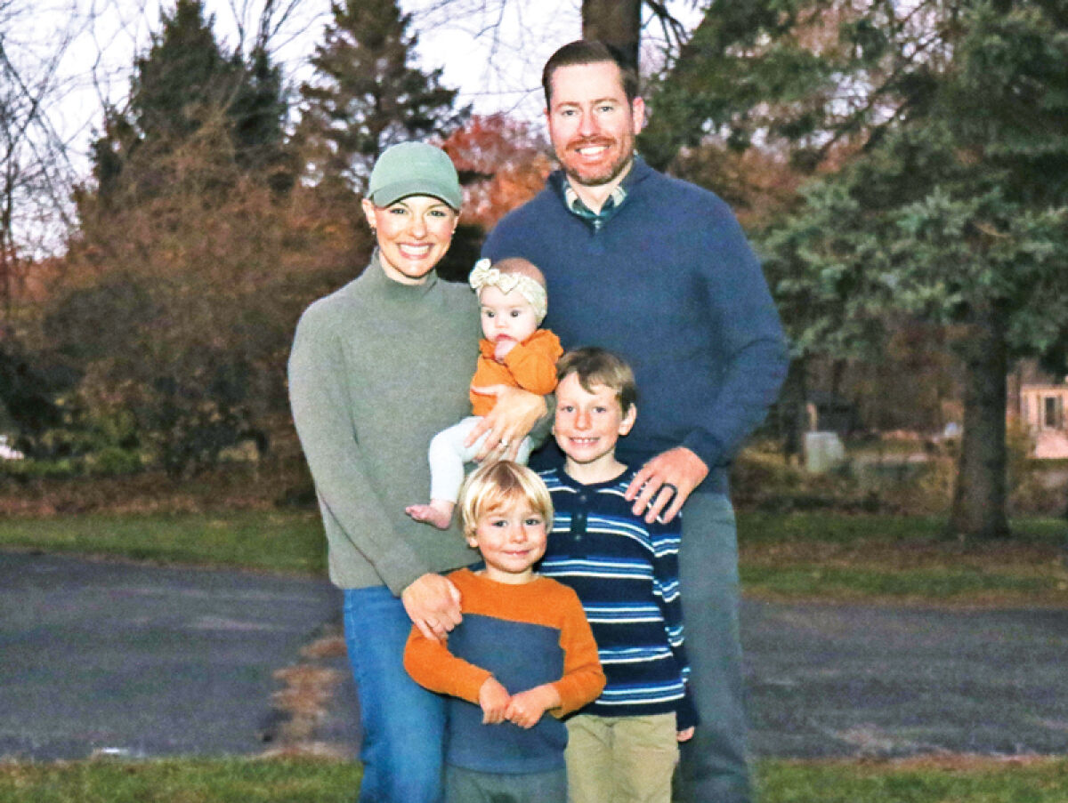  The McGee family — Adam, a Novi police officer; Katie, who is undergoing treatment for breast cancer; Penny, 5 months; Theo, 7; and Cooper, 4, smile for a picture Nov. 7. 