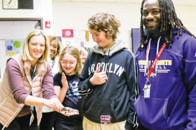  Laura Shultz, a teacher at Wilkinson Middle School, shows off “Spike,” the lake sturgeon she and her students are raising for release into the wild. The effort is part of a program through the state that aims to restore the endangered species. 