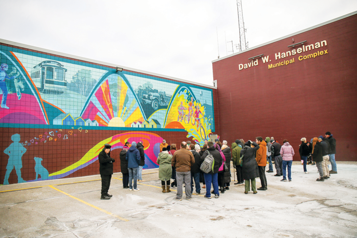  Many braved the frigid temperatures for the unveiling of the “Small, but Strong” mural, by Wendy Popko. This artwork pays homage to Center Line’s past while celebrating the city’s present and possibilities yet to unfold.  