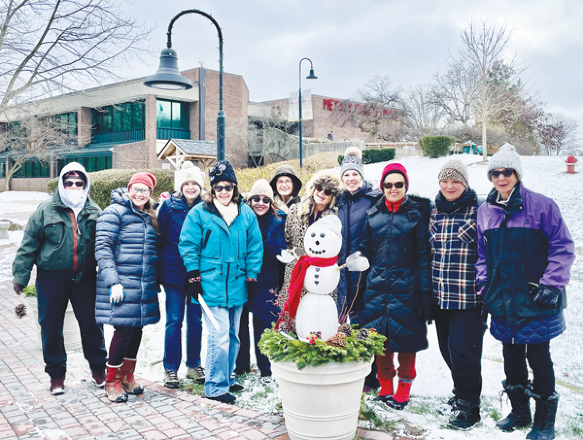  The Shelby Gardeners Club bundled up in freezing temperatures to put out its decorations. 