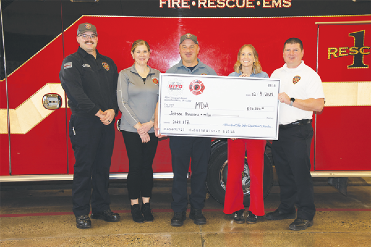  Left to right, Bloomfield Township Firefighter/Paramedic Alec Fowler, Bloomfield Township Fire Department Administration Assistant Kelly Lagarde, Bloomfield Township Fire Lt. Chris Hull, Muscular Dystrophy  Association Account Manager Stacey Breitlow, and Bloomfield Township Fire Capt. Mike Sova  pose with a $16,000 check raised at a recent “Fill the Boot” event. 