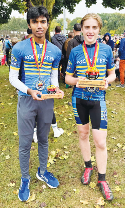  Brayden Willams and Aditya Kandage display their respective awards at the MiSCA Rochester Bike Shop Mountain Bike XC Race at Addison Oaks County Park. 