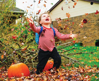  Marie Krakosky’s photo of a young girl, Charlie, playing in the leaves took second place. 