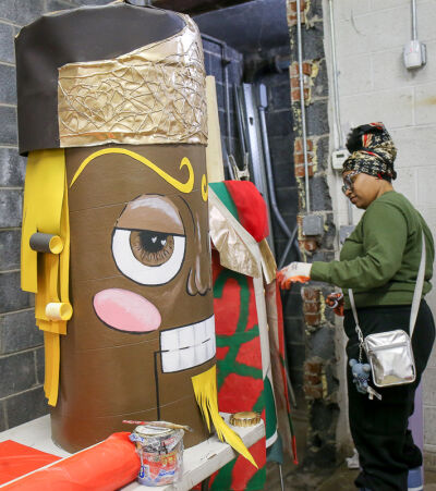  Malia Alford, of Southfield, aims to promote a message of love and kindness through her nutcracker, “King Choco,” the giant chocolate king of hearts. 