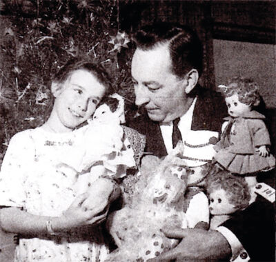  F.J. Brady’s father, Frank J. Brady, is pictured in 1958 delivering dolls to a little girl in a Detroit hospital, a tradition that Detroit Goodfellows founder James Brady started. 