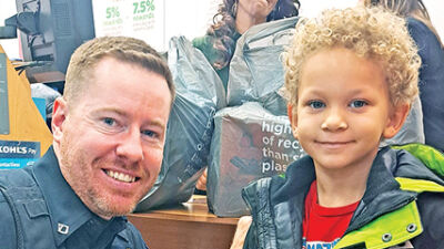  Novi’s police, firefighters take underprivileged youth shopping 