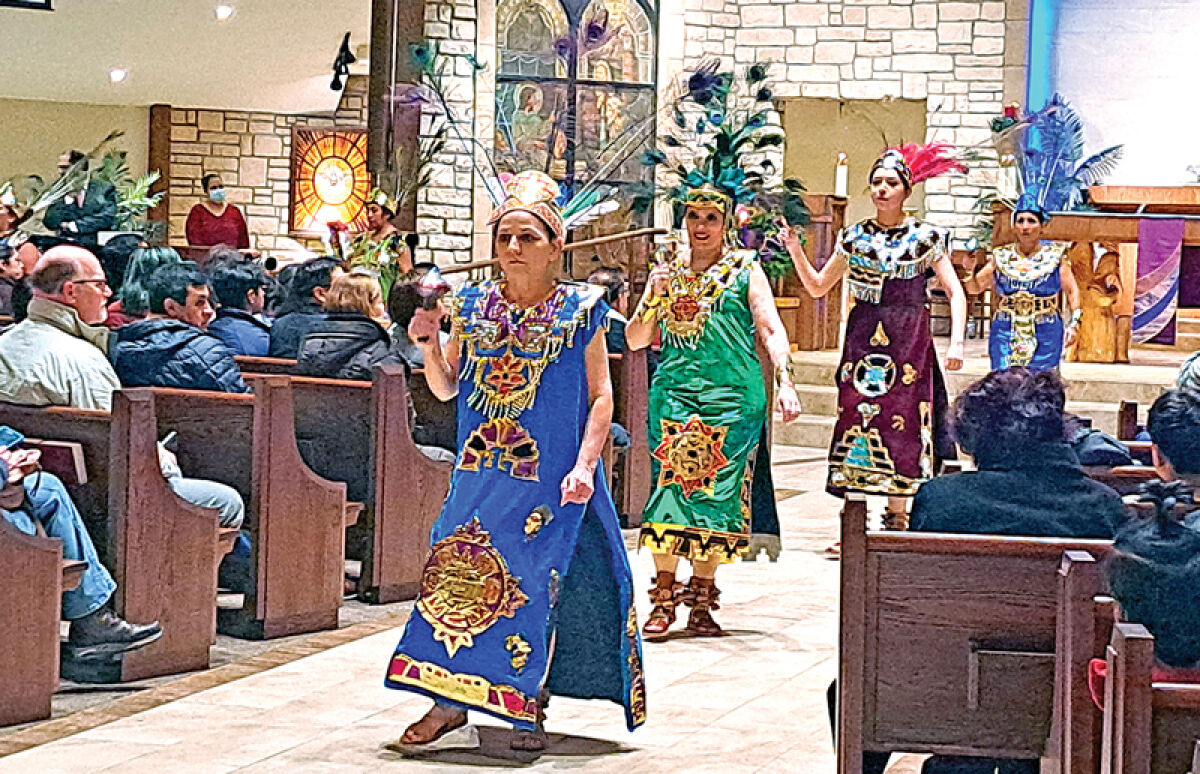  The Ballet Folklorico Mexico Lindo performs a traditional Concheros dance before the Our Lady of Guadalupe Mass at the Catholic Church of the Holy Family in Novi Dec. 12. 