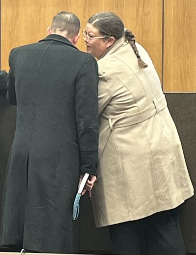  Fitzgerald Public Schools Superintendent Hollie Stange, right, confers with her attorney William Barnwell, left, after the bond hearing Dec. 23 in Warren’s 37th District Court.  