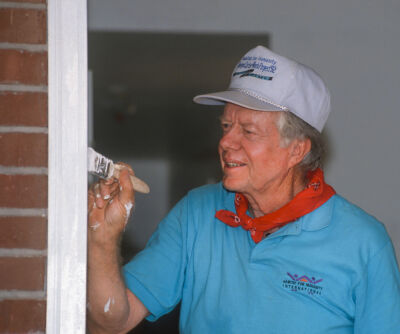  Former President Jimmy Carter, working with Habitat for Humanity, paints a doorframe June 18, 1992, during a project on Benning Road in Washington, D.C. 