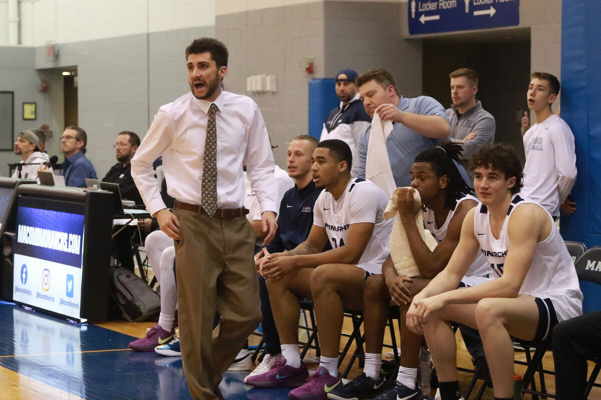  Macomb Community College head coach Christopher Burns leads his team during a matchup against Owens Community College Dec. 18 at the Macomb Community College Athletic Center on the South Campus in Warren. 