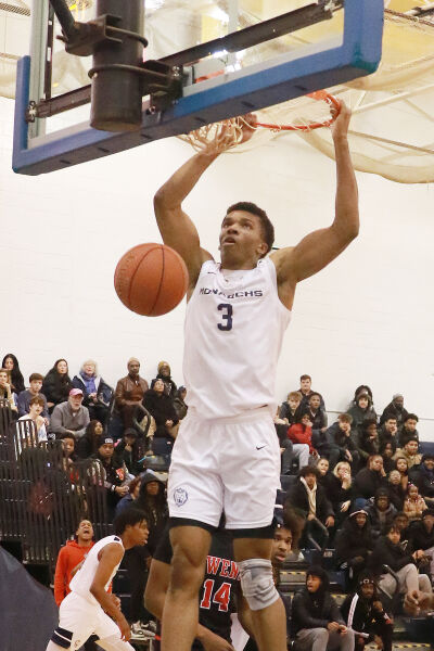  Macomb Community College sophomore Jotham Nweke, a Detroit Loyola graduate, slams home a dunk. 