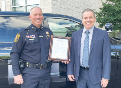  Jeff King, left, the former chief of police for the Farmington Hills  Police Department, recently accepted a position as the  public safety director in Bloomfield Hills. 