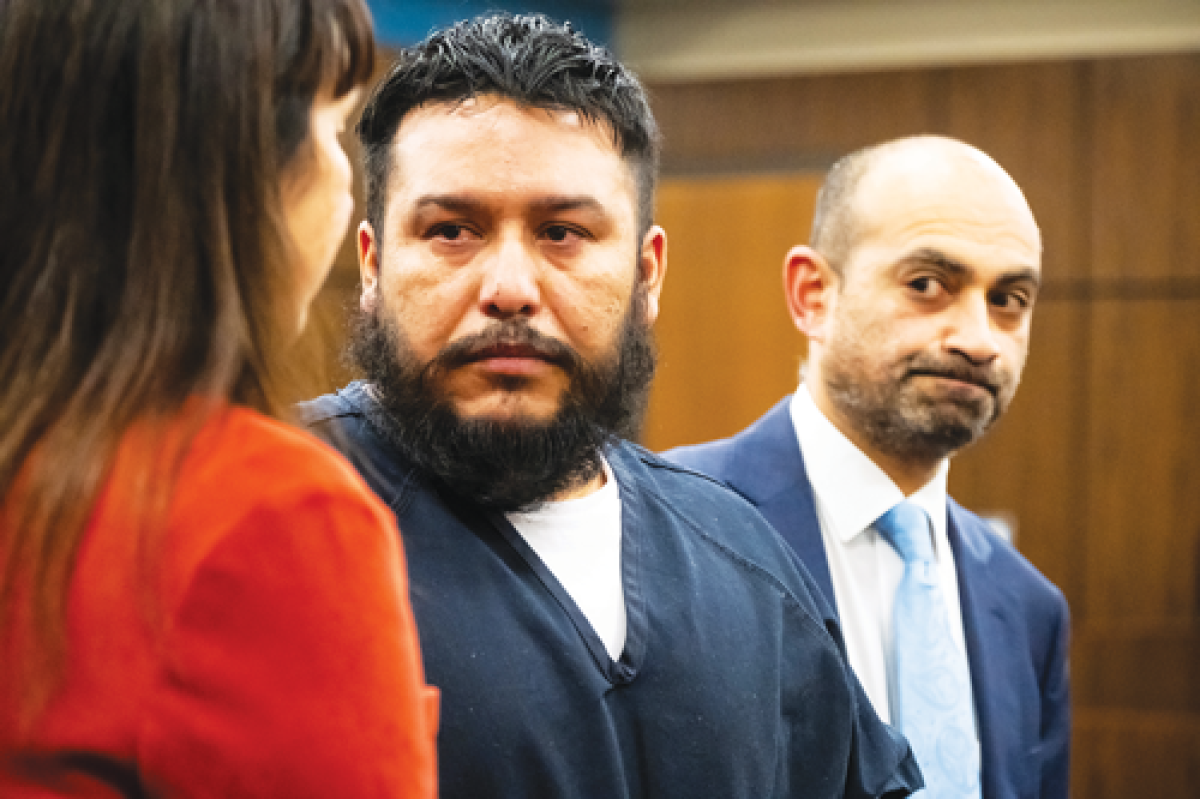  Jose Eugenio Medina-Hernandez, center, becomes emotional while addressing family members of victims who died in a crash during his sentencing hearing Monday, Dec. 30, 2024, in the 41A District Court in Shelby Township. Medina-Hernandez, 33, was found guilty of two counts of moving violation causing death after a June crash that left two women dead. With Medina-Hernandez is a translator and attorney Mani Khavajian. 