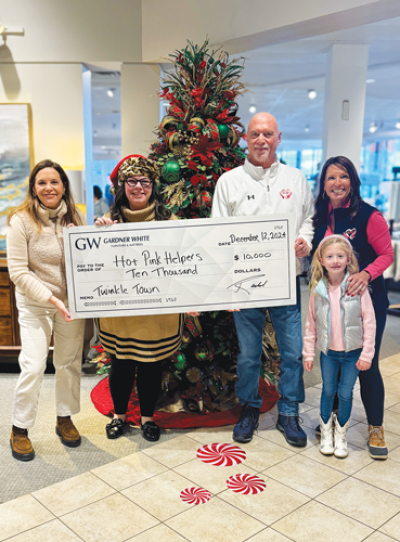  Melissa Morrow, second from left, won $10,000 for her charity of choice, Hot Pink Helpers, during the third annual Gardner White “Parade of Trees” contest in Warren. Also pictured are Gardner White CEO Rachel Stewart, far left; Bill Wylonis, of Hot Pink Helpers, center; Hot Pink Helpers cofounder Linda Sebold Clogg, far right; and her granddaughter, Caroline Wulf. 