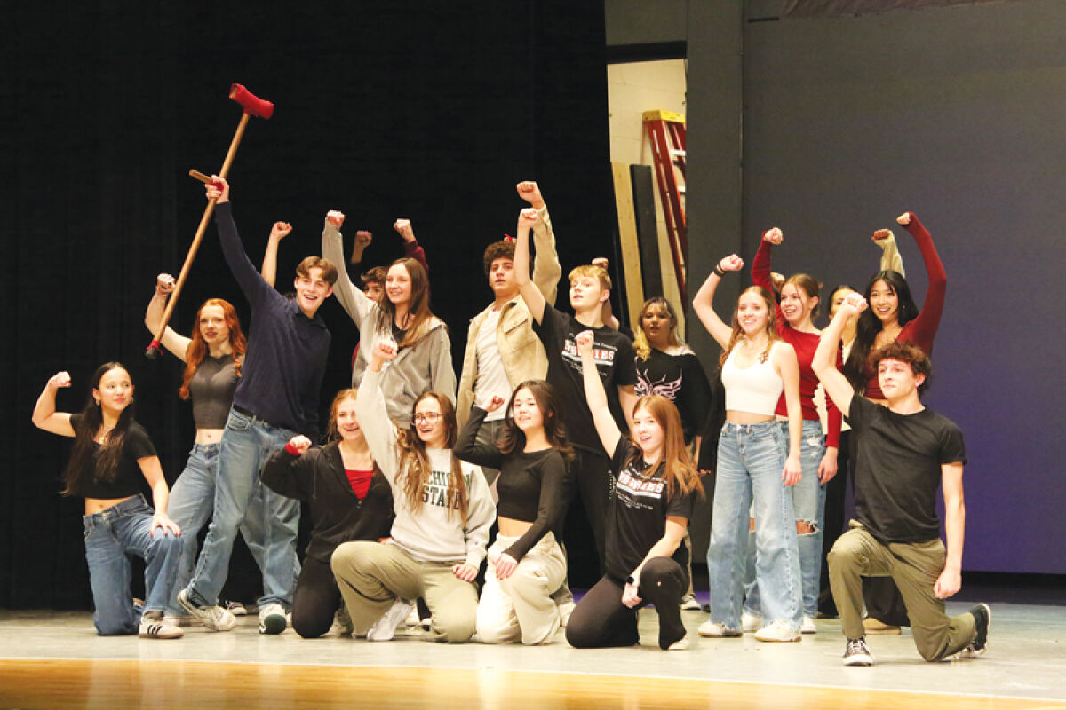  The cast of Dakota High School’s “Newsies” strikes a pose during the number “Seize the Day.” 