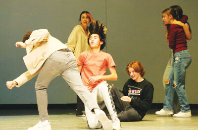  Junior Salvatore Vitale, 16, prepares and swings a punch at a Pulitzer thug. 