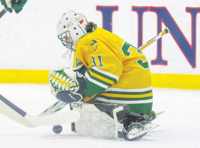   Grosse Pointe North sophomore goalie Ben Bugeja makes a stop during a 6-1 loss to  Grosse Pointe South Dec. 20 at McCann Ice Arena. 