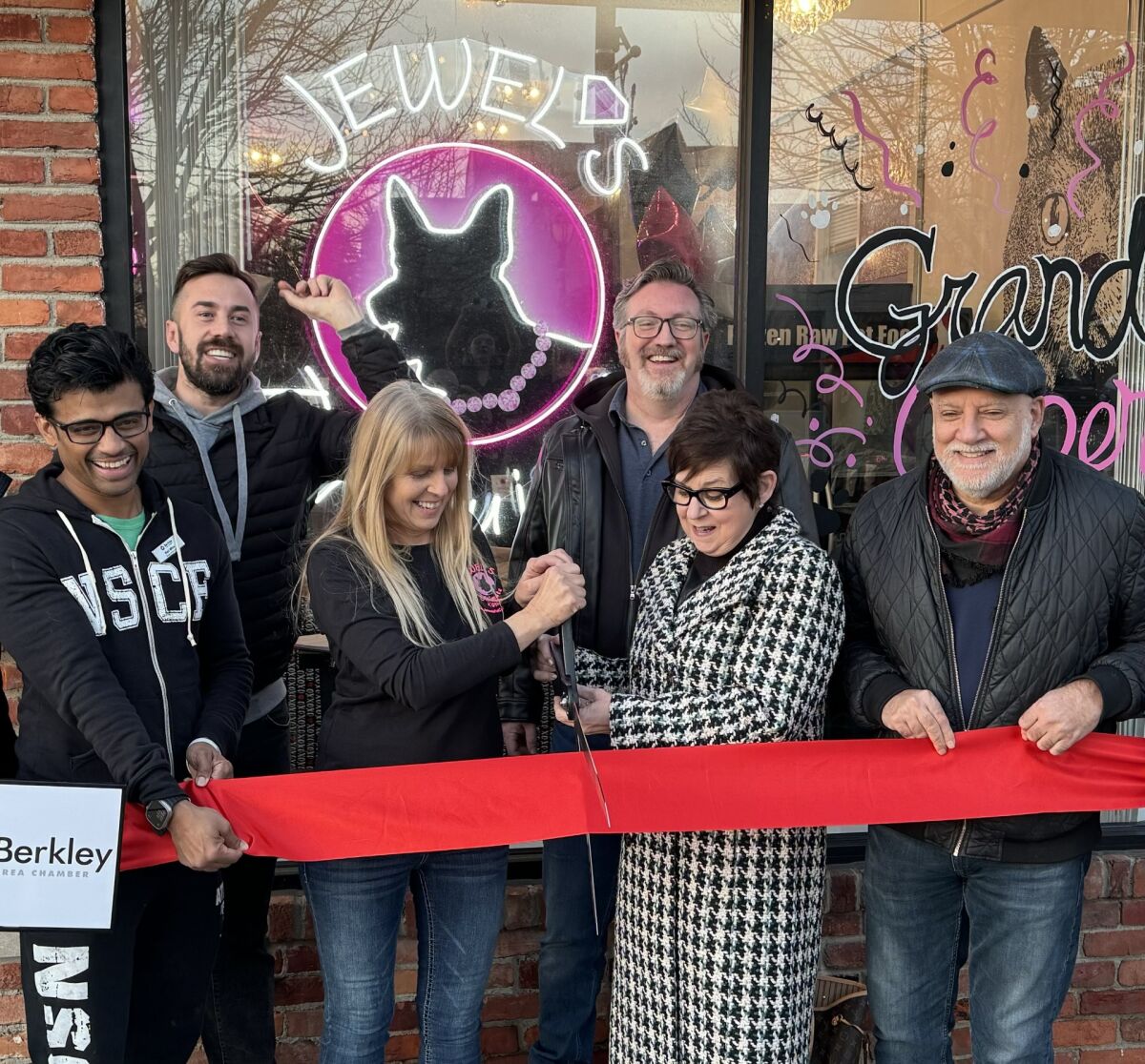  Berkley Downtown Development Authority Executive Director Mike McGuinness, second from left, leads the crowd in a countdown to the ribbon-cutting for Jewel’s Pet Cuisine on 12 Mile Road in Berkley in February last year. With McGuinness are Rish Mitra, Urge Juice owner; Coleen Stomber, Jewel’s Pet Cuisine owner; Berkley City Councilman Steve Baker; Berkley Mayor Bridget Dean; and Berkley Area Chamber President Tim Murad. McGuinness will be resigning and leaving his job on Feb. 14. Berkley has begun accepting applications for the position. 