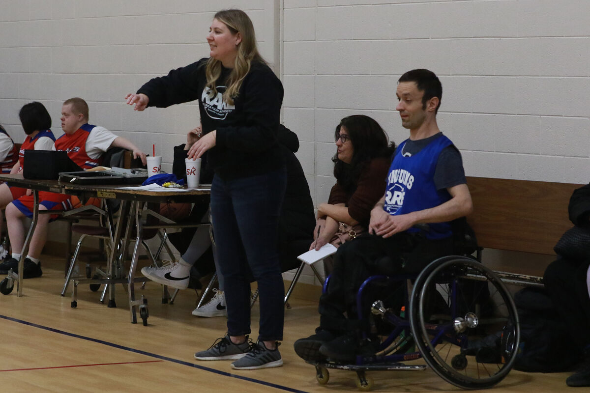  RARE Assistant Director and Penguins coach Sara Frederick cheers on the team Jan. 9. Next to her is player Zack Maracle, who wears No. 5. 