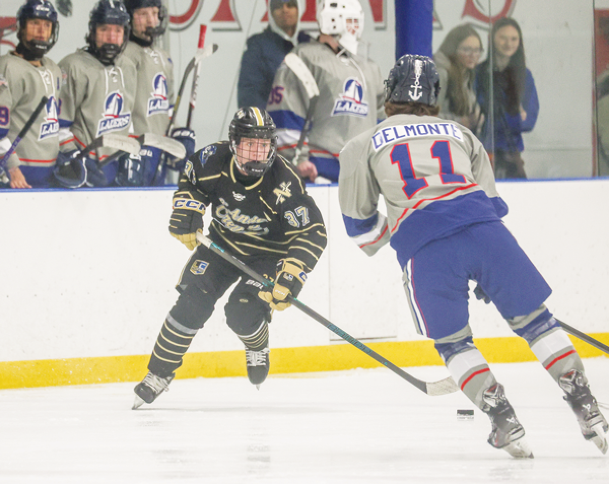  Logan Jarvey, a junior forward and the team point leader for L’Anse Creuse Unified, carries the puck in a game against St. Clair Shores Unified Jan. 14. 