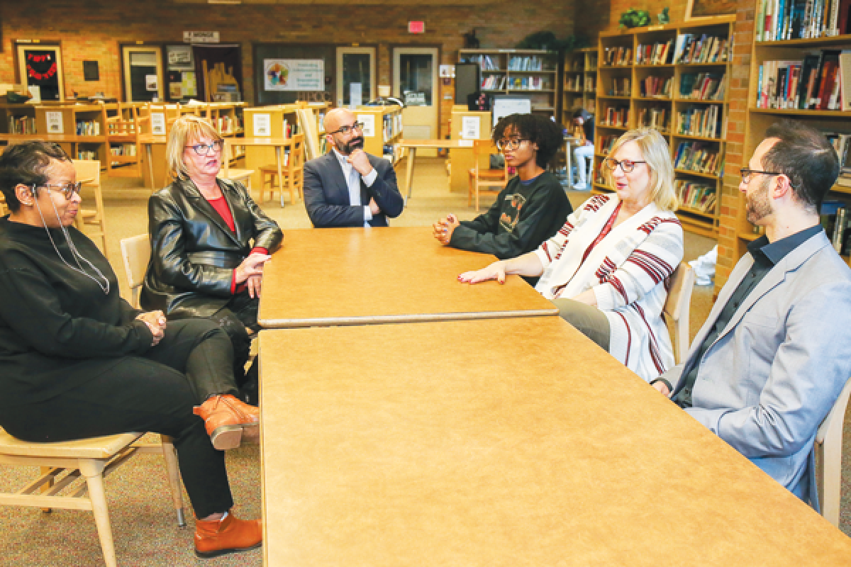  Board members of the Hazel Park Community Coalition meet with Shana Williams, left, its new executive director. Clockwise from Williams are Robin May, representing the media sector; Richard Shunnarah, representing the business sector; Autumn Jackson, a senior Hazel Park High School student representing the youth sector; Karla Graessley, representing the school sector; and Benjamin Ervin, board president. Also present was Hazel Park Police Det. Qani Toro, representing law enforcement.  