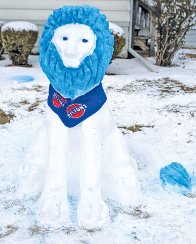  Patty Kirk and her daughter, of St. Clair Shores, created this snow sculpture of a Lion with a Detroit Pistons scarf around its neck. 