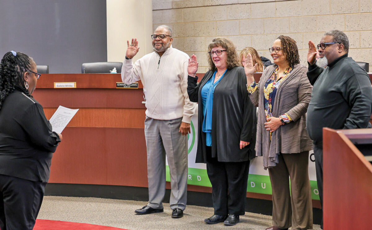  Newly elected Eastpointe Community Schools Board of Education President Chineva Early, far left, administers the oath of office to, from left, Robert Roscoe, Shelly Cioppa, Darlene Whitby and Edward Williams. 