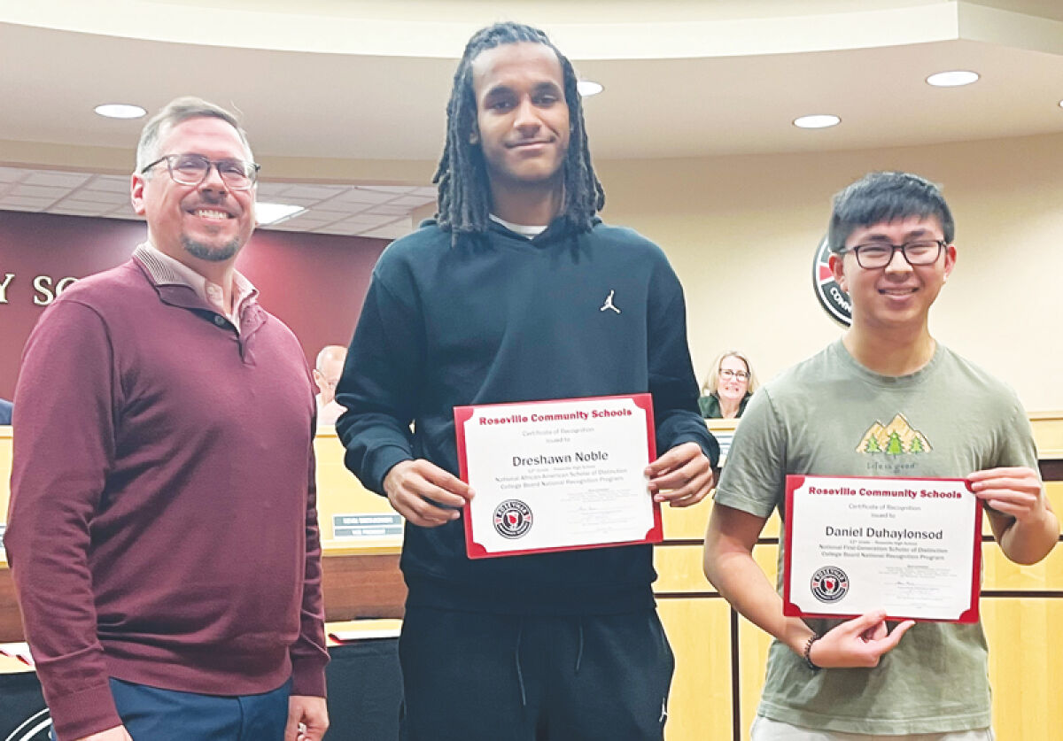  Roseville High School Principal Jason Bettin, left, was among the Roseville Community Schools educators who recognized students Dreshawn Noble, center, and  Daniel Duhaylonsod, right, who received “Scholar of Distinction” academic honors from the College Board National Recognition Program. 