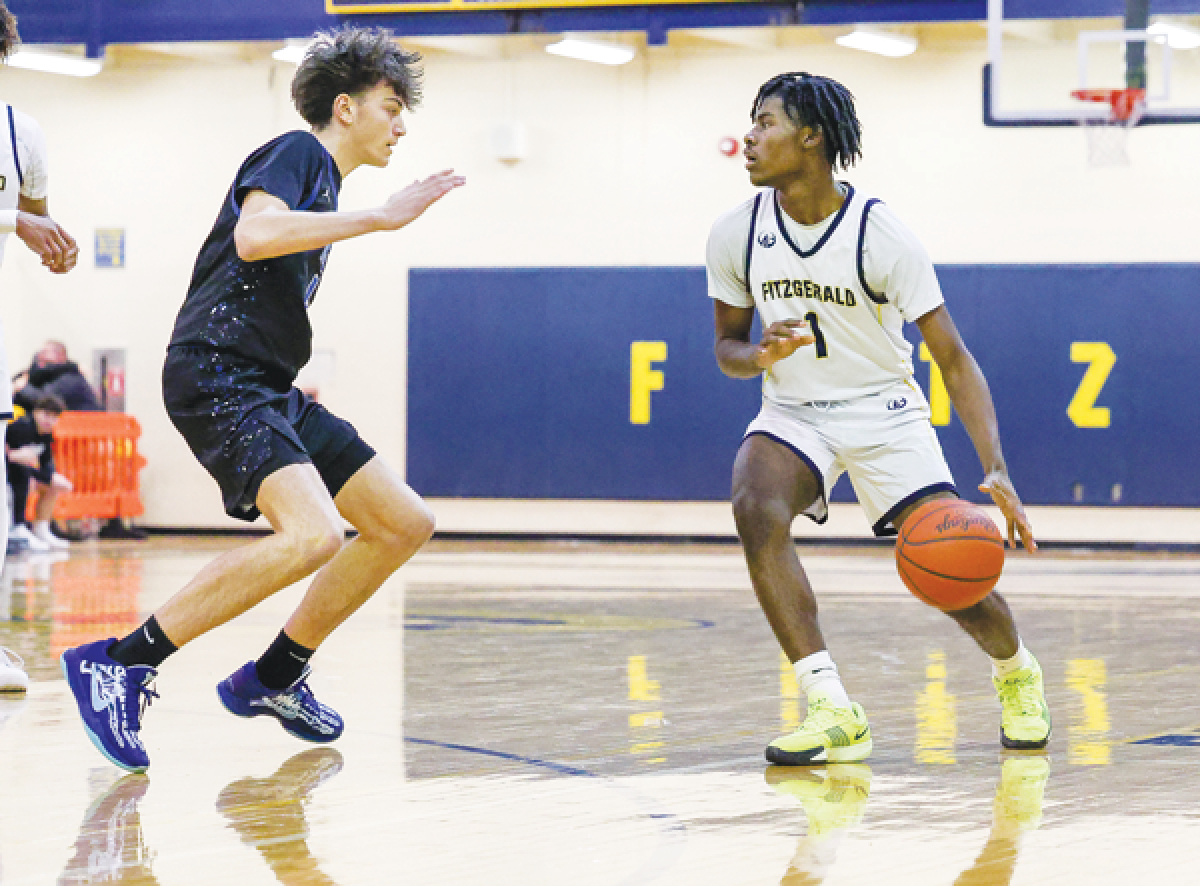  Warren Fitzgerald sophomore Quenten Graham controls the ball. 